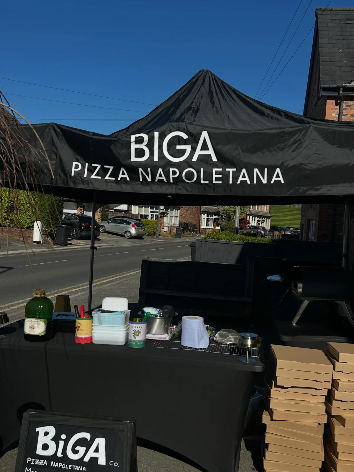 The black Biga gazebo set up on a Wilmslow street